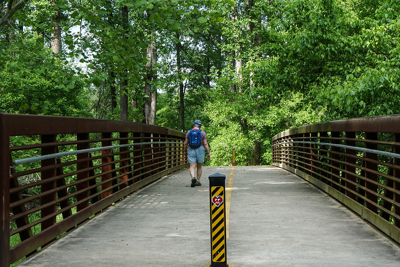 A scenic pedestrian trail on the Atlanta BeltLine with bikers and joggers.
