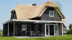 Restored craftsman cottage with original porch columns and wood windows