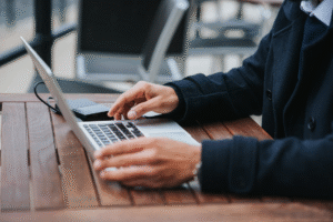 A property manager reviewing smart building data on a laptop dashboard