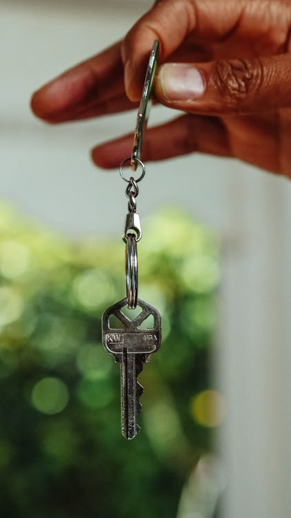 A manager handles keys for a multi-family unit.